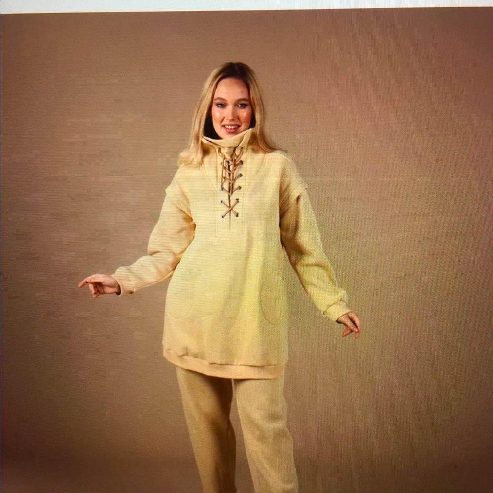 Woven sweat shirt and pant set.